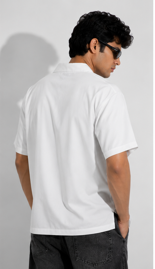 Man wearing a white t-shirt with a blue graphic design on the front, shown from front, side, and back views.